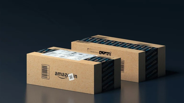 two boxes of amazon are stacked on top of each other