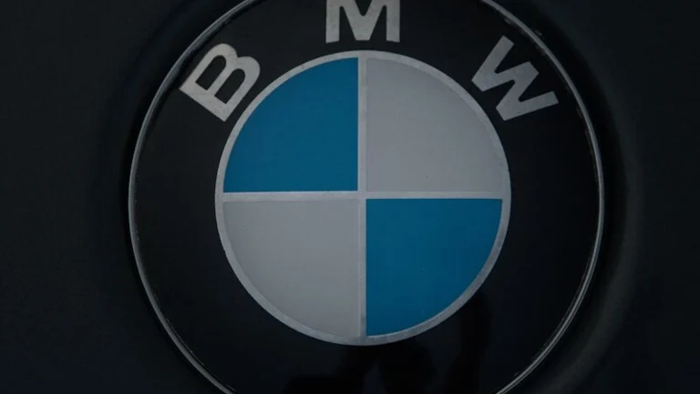 The BMW logo on a dark surface.