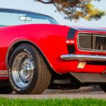 a red car parked on the side of the road