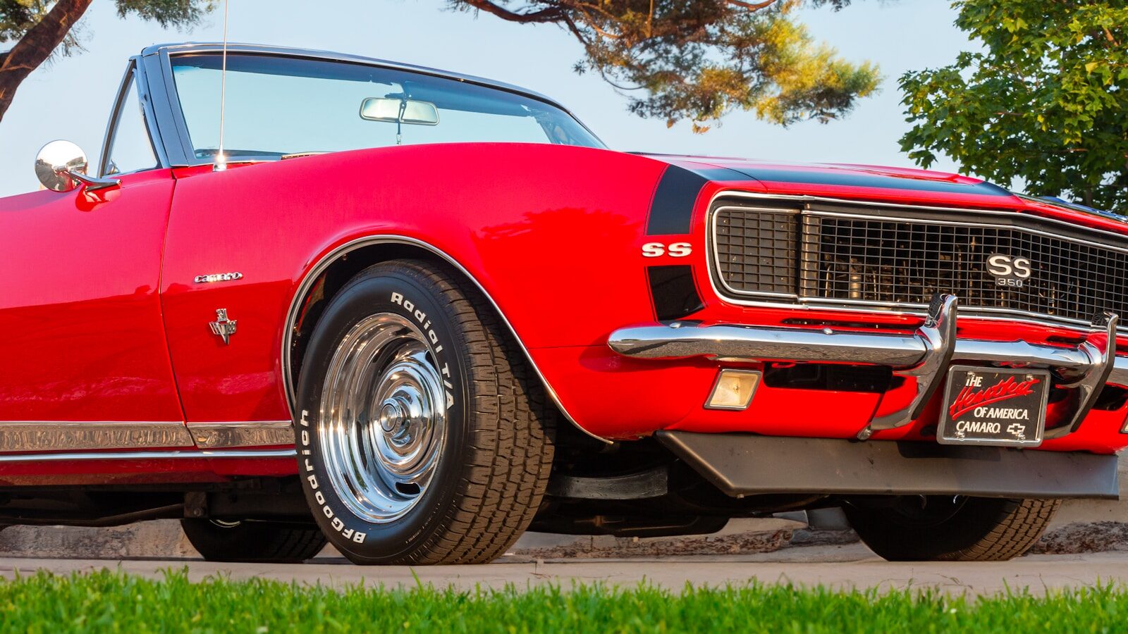 a red car parked on the side of the road