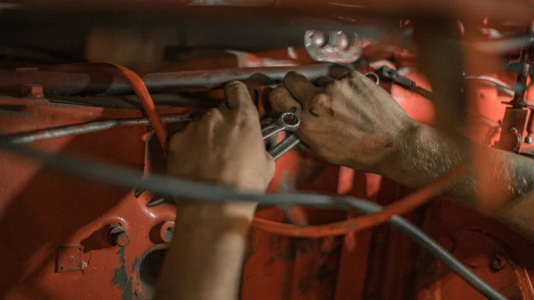 person holding red metal frame