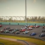 NASCAR Cup Series stock cars racing side by side on track