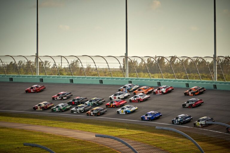 NASCAR Cup Series stock cars racing side by side on track