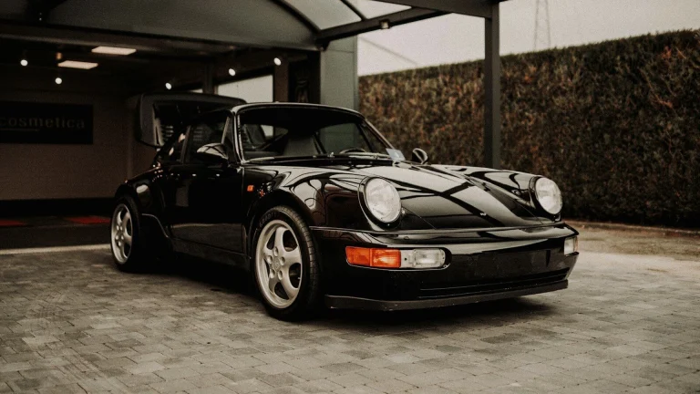 black porsche 911 parked in garage