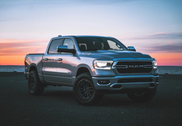 a silver ram truck parked in a parking lot