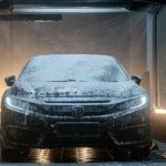 a car is covered in snow in a garage