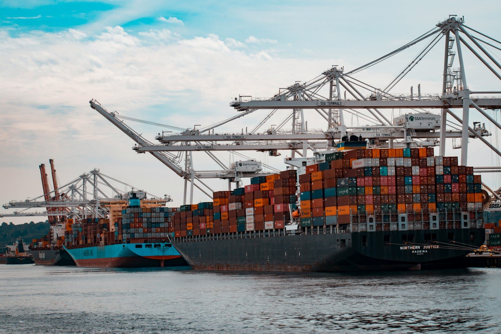 Shipping containers stacked at a U.S. seaport, similar to those CBP officers screen for stolen vehicle exports