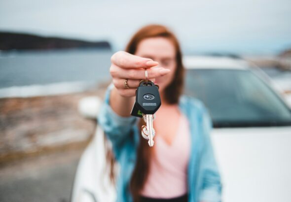 focus photography of black vehicle key