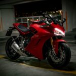 red and black sports bike
