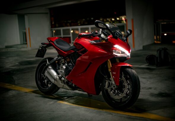 red and black sports bike