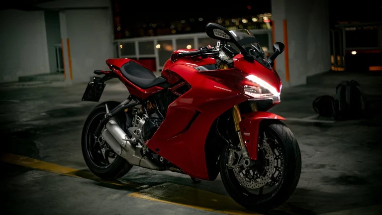 red and black sports bike