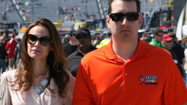 Samantha Busch and Kyle Busch walking through a NASCAR pit area