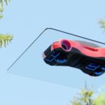 A video game controller hanging from a tree