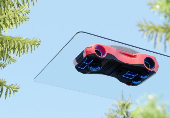A video game controller hanging from a tree