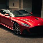 a red sports car parked in front of a building