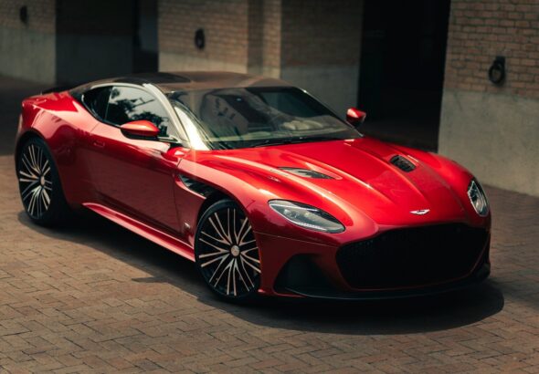 a red sports car parked in front of a building