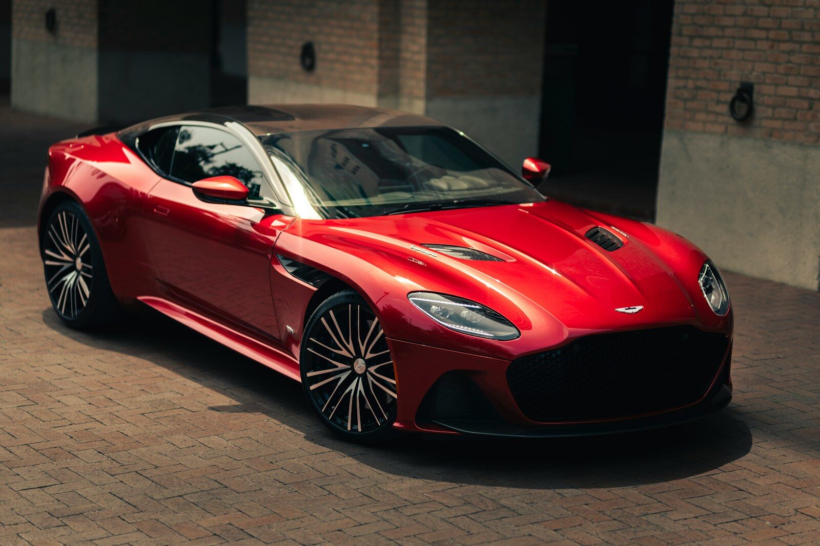 a red sports car parked in front of a building