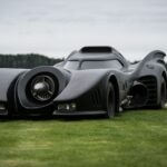 a car that is sitting in the grass