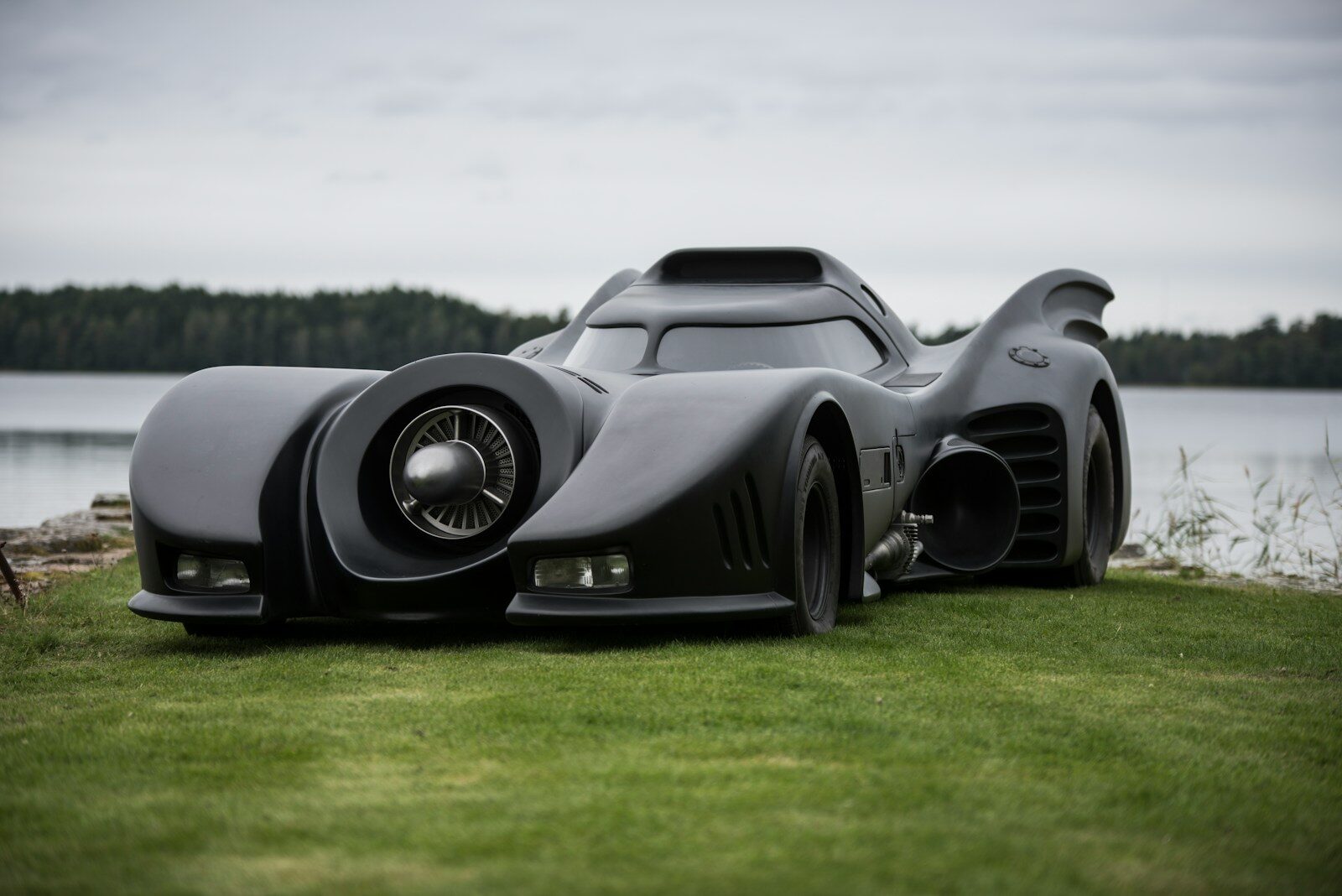 a car that is sitting in the grass