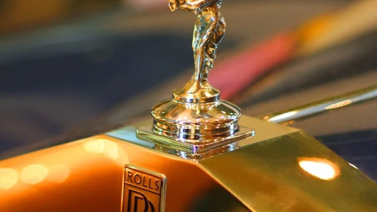 Rolls-Royce Spirit of Ecstasy hood ornament on a Corniche-era grille