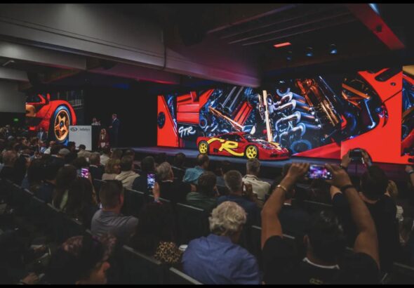 1996 McLaren F1 GTR on the auction stage at RM Sotheby's Monterey 2026 sale, where it sold for $34,655,000