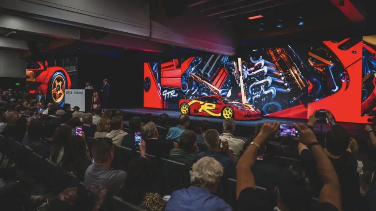 1996 McLaren F1 GTR on the auction stage at RM Sotheby's Monterey 2026 sale, where it sold for $34,655,000
