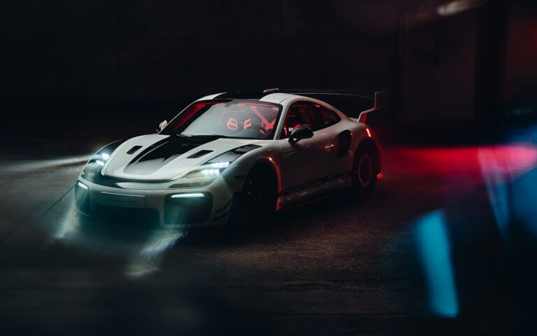 Porsche 911 Flachbau RS one-off in Grand Prix White showing its slant-nose front end and stacked LED headlight units