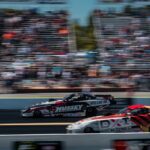 Nitro drag racing funny car launching off the line at a dragstrip