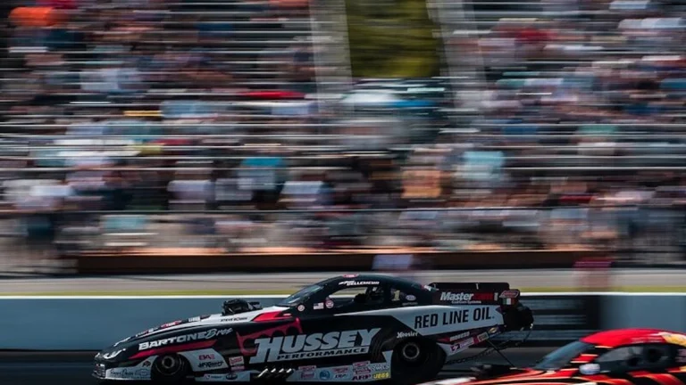 Nitro drag racing funny car launching off the line at a dragstrip
