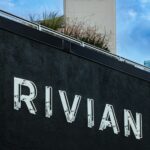 The rivian logo is displayed on a building.