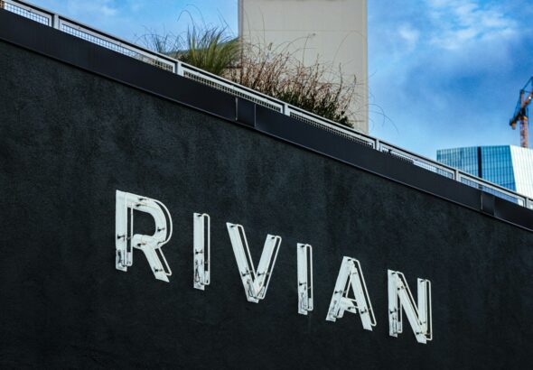 The rivian logo is displayed on a building.