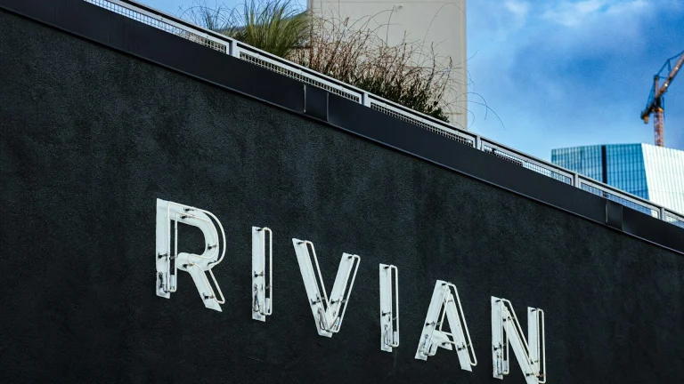 The rivian logo is displayed on a building.