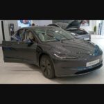 2025 Tesla Model 3 Long Range on display at a Tesla store