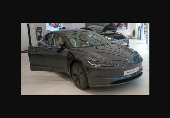 2025 Tesla Model 3 Long Range on display at a Tesla store