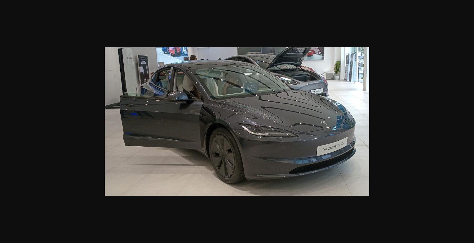 2025 Tesla Model 3 Long Range on display at a Tesla store