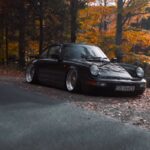 a black sports car parked on the side of a road