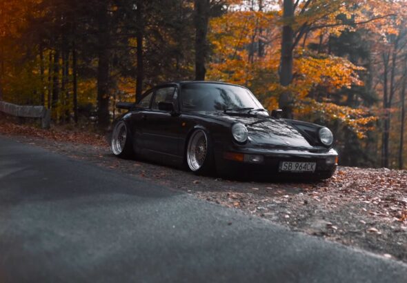 a black sports car parked on the side of a road