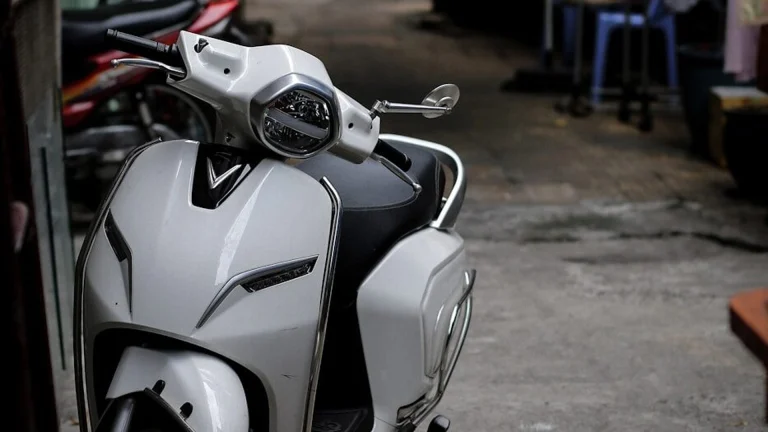 a white and black motorcycle parked next to a building