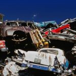 a pile of old cars sitting next to each other