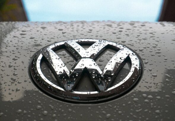 water dew on silver Volkswagen car emblem