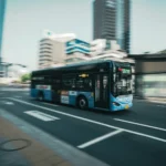 a bus driving down a street