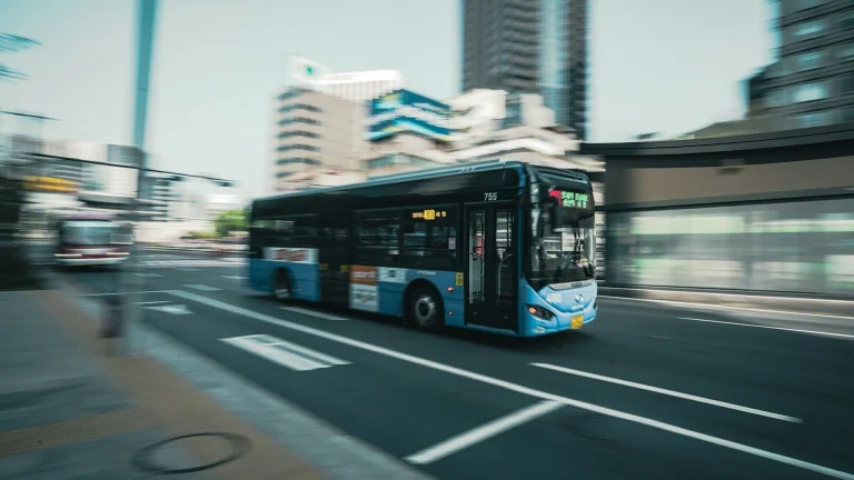 a bus driving down a street