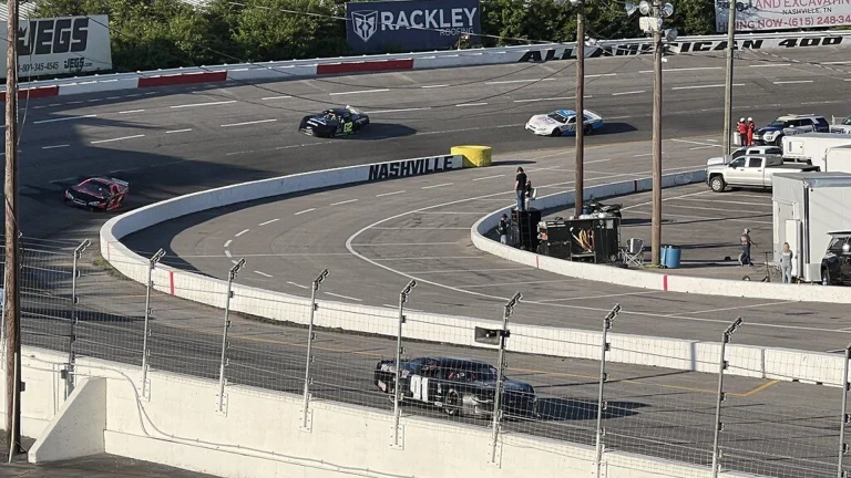 A Pro Late Model race car navigates a turn during weekly short-track racing action at Nashville Fairgrounds Speedway.