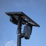 A solar panel powers a security camera