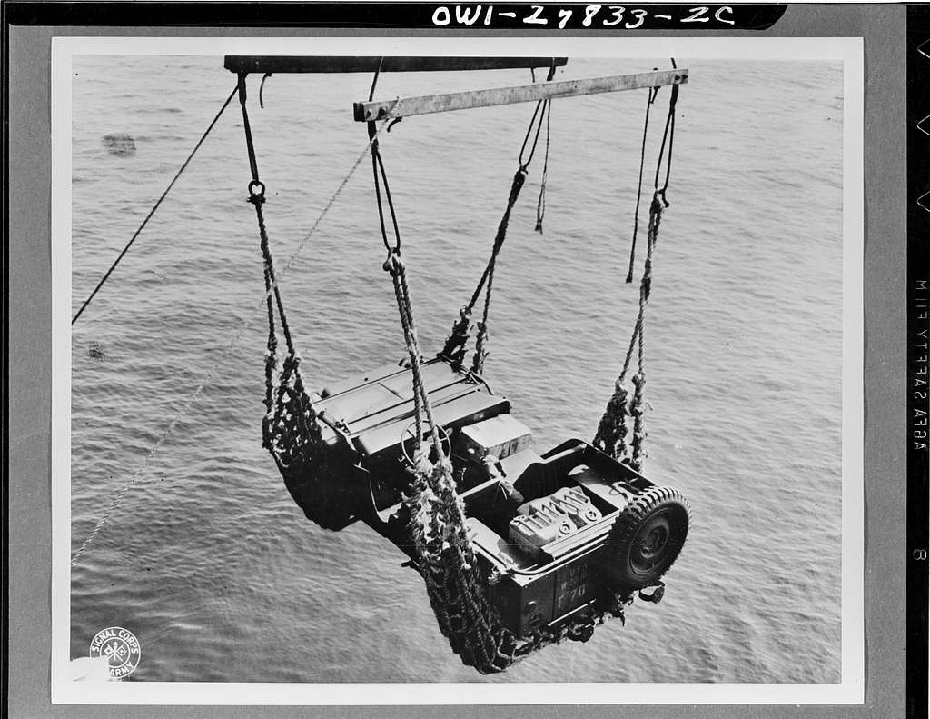 Bantam BRC-40 jeep being lowered by crane onto a Higgins landing craft during 1941 amphibious exercises