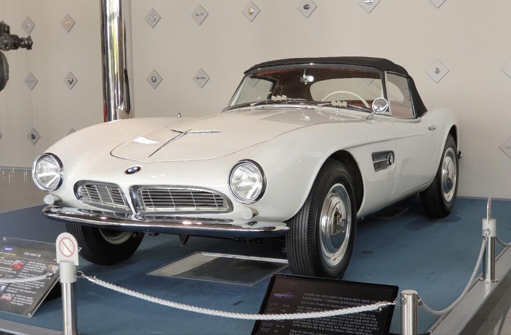 A white 1957 BMW 507 Roadster, the color BMW unveiled the 507 in at the 1955 Frankfurt Motor Show, on museum display
