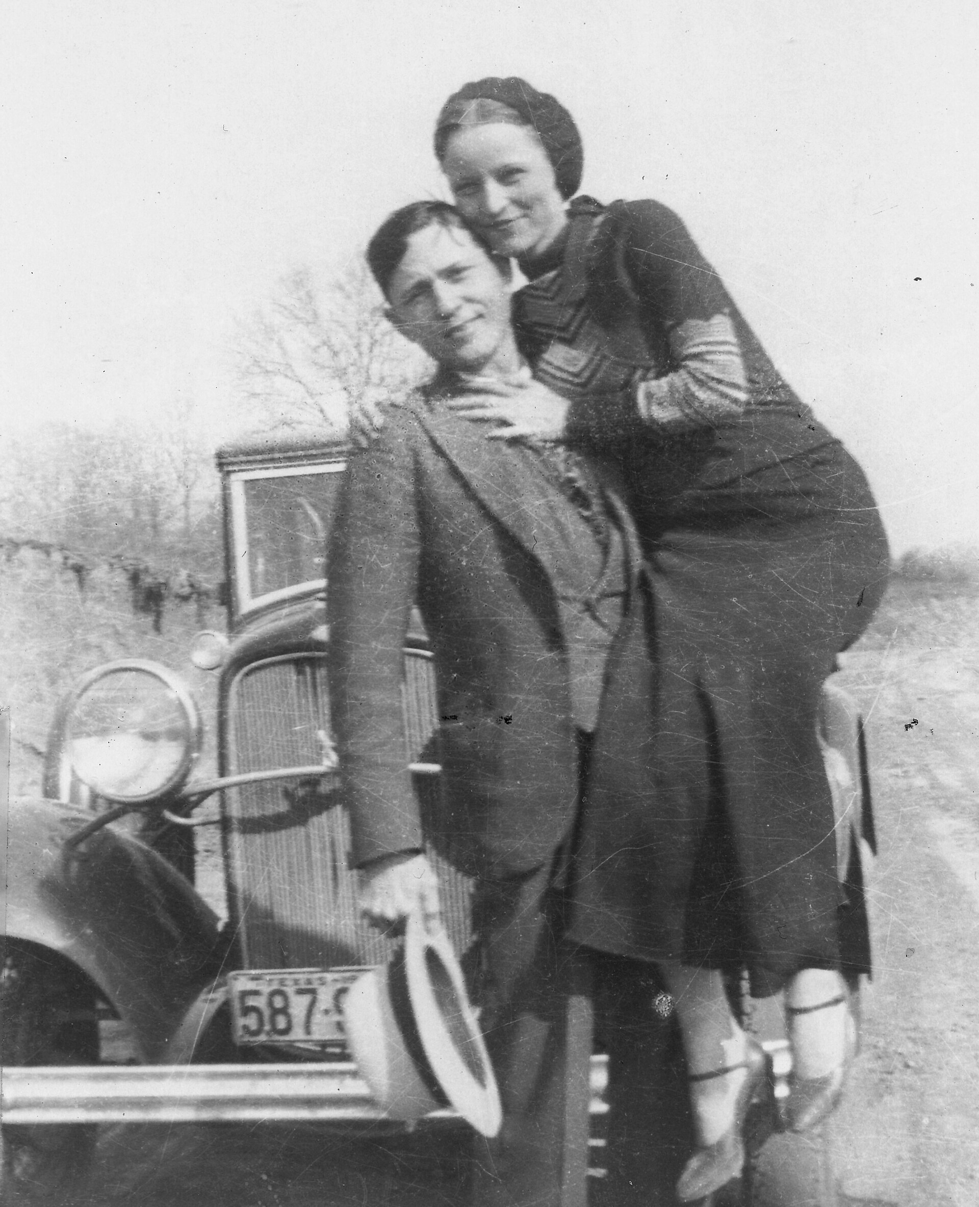Bonnie Parker and Clyde Barrow posing together in the early 1930s