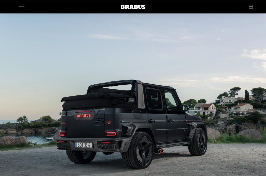Rear three-quarter view of the BRABUS 900 ROCKET EDITION CABRIO with the two-piece soft top stowed
