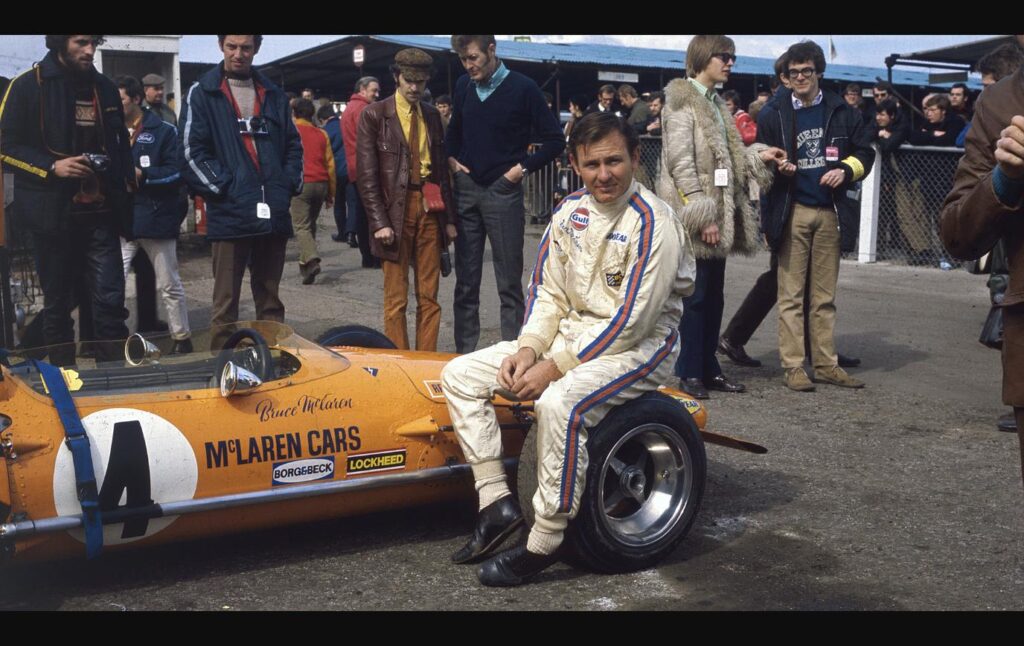 Bruce McLaren sitting on his McLaren-Ford M14A before the Race of Champions at Brands Hatch, March 1970
