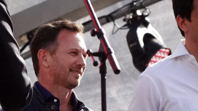 Christian Horner smiling on stage at the F1 Live event in London in July 2017